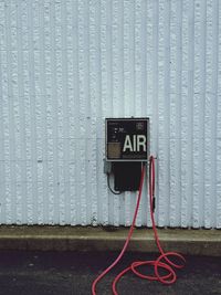 Air pump on wall at fuel pump