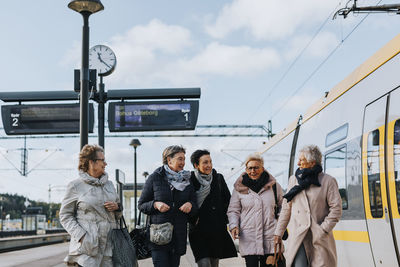 Women on train station platform