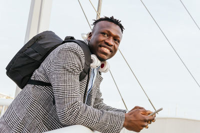 Portrait of young man using smart phone