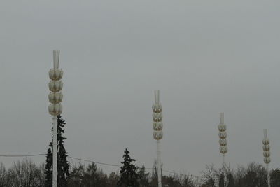 Low angle view of communications tower against clear sky