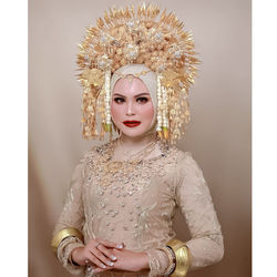 Portrait of young woman wearing bridal make up