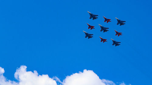 Low angle view of airshow in sky