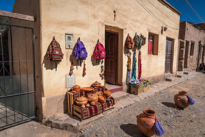 Clothes hanging on clothesline at market stall