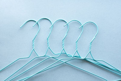 Hangers for clothes on blue background