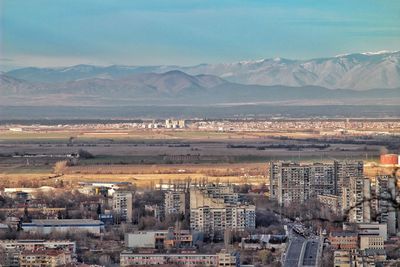 Aerial view of cityscape against sky