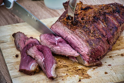 High angle view of meat on cutting board