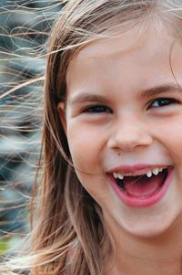 Close-up portrait of smiling girl