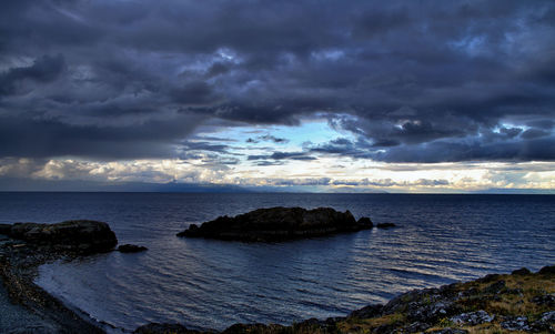 Scenic view of sea against dramatic sky