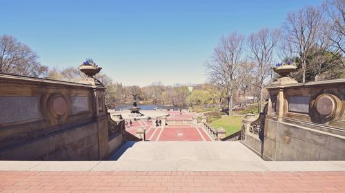 Staircase in park against clear blue sky