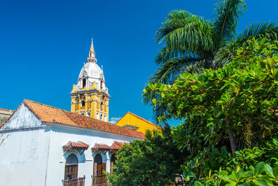 Low angle view of cartagena cathedral against clear blue sky in city