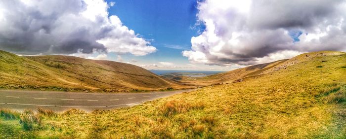 Panoramic view of irish landscape with blue sky. connors pass county kerry looking south. ireland.