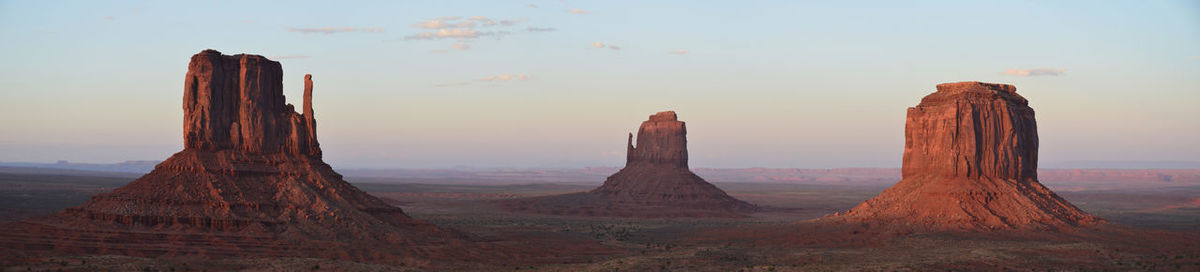 Panoramic view of rock formations against sky during sunset