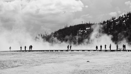 People by hot spring at yellowstone national park