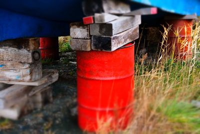 Close-up of red metal structure on field