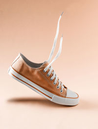 Close-up of shoes against white background