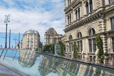 Buildings in city against sky