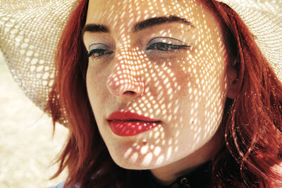 Close-up of woman wearing hat