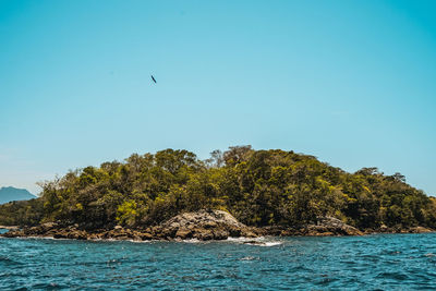 Scenic view of sea against clear sky