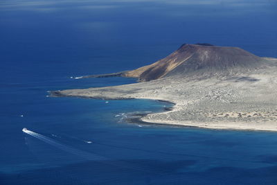 Scenic view of volcanic mountain and sea