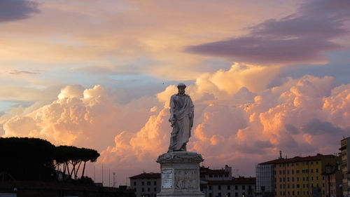 Low angle view of statue against cloudy sky