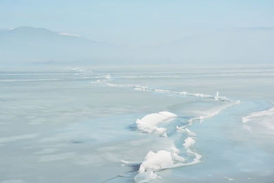 Huge crack in the surface of the frozen lake orestiada in kastoria , greece