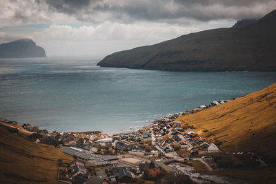 High angle view of houses by sea in town