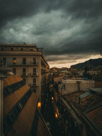 High angle view of buildings in city at dusk