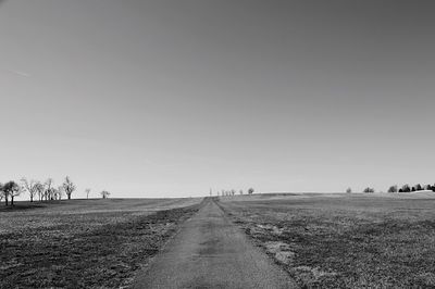 Scenic view of agricultural field against clear sky