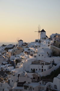 Townscape against sky during sunset