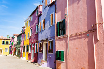 Residential buildings by street in city