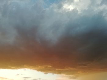 Low angle view of cloudy sky during sunset