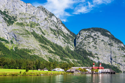 Scenic view of lake and mountains against sky