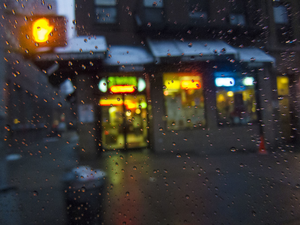 RAIN DROPS ON GLASS WINDOW