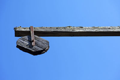 Low angle view of old building against blue sky