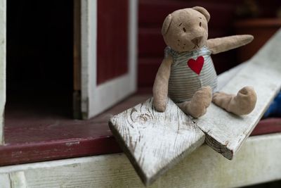 Close-up of stuffed toy on window sill