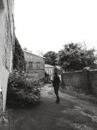 Full length of woman walking on road