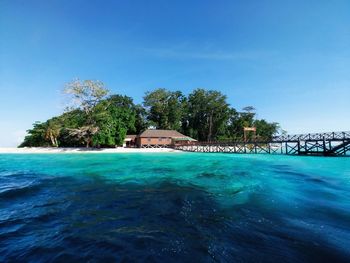 Scenic view of sea against blue sky