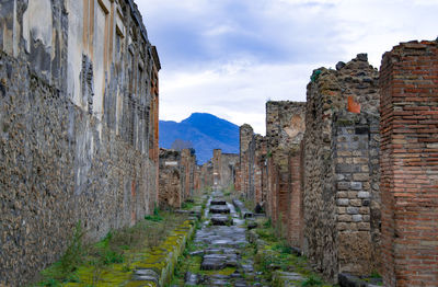 View of old ruin building against cloudy sky