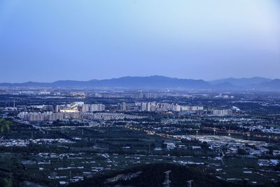 High angle view of buildings in city against clear sky