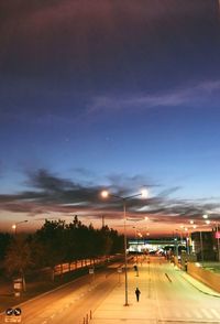 Road against sky at night