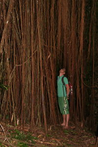 Woman standing in forest