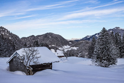 Scenic view of snow covered mountains against sky