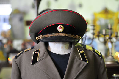 Close-up of police uniform on mannequin at store