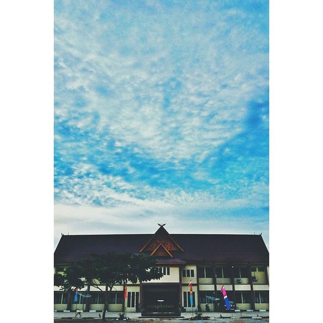 transfer print, building exterior, sky, architecture, built structure, auto post production filter, house, cloud - sky, residential structure, cloud, residential building, cloudy, city, blue, day, outdoors, low angle view, window, building, no people