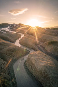 Scenic view of river against sky during sunset