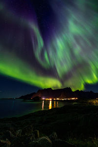 Scenic view of sea against sky at night