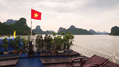 Scenic view of sea and mountains against sky