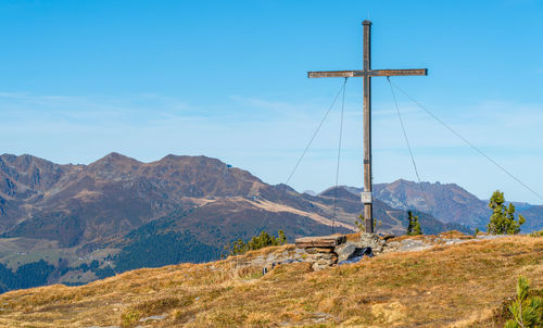 Scenic view of mountains against clear blue sky