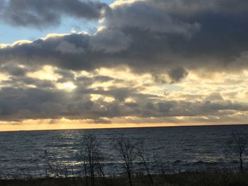 Scenic view of sea against cloudy sky