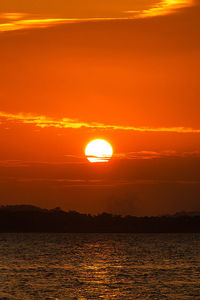 Scenic view of sea against romantic sky at sunset